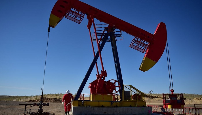 PetroChina worker inspects a pump jack at an oil field in Tacheng, Xinjiang Uighur Autonomous Region, China June 27, 2018. —Reuters/File