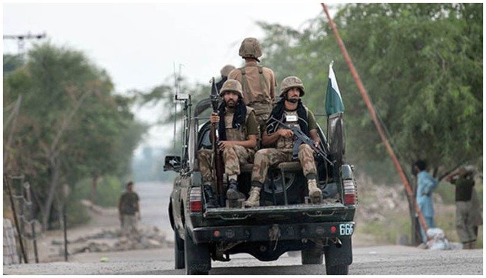 Pakistan Army personnel travelling in a military vehicle in this undated picture. — AFP