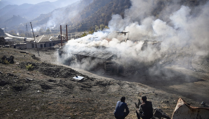 This photograph released on November 14, 2020, shows thick plumes of smoke rising over the different places in the valley as a lasting solution to the decades-long conflict of Nagorno-Karabakh remains elusive. AFP