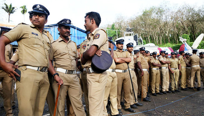 Police personnel stand guard at the Nilakkal Base Camp to prevent clashes in the southern state of Kerala, India, ON October 17, 2018. — AFP