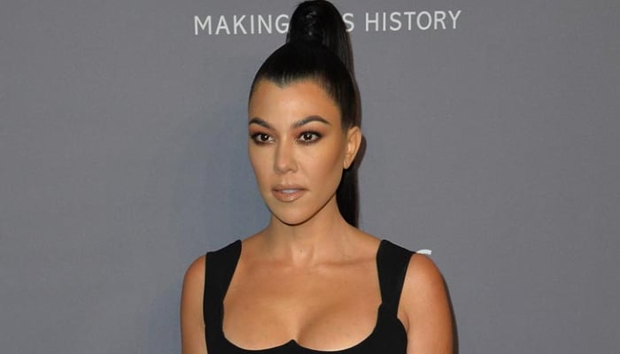 Pregnant Kourtney Kardashian promotes stepsons music debut