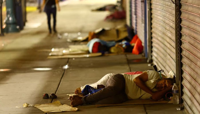 Migrants sleep on the street after being released from U.S. Border Patrol custody in downtown El Paso, Texas, U.S., September 12, 2023. — Reuters/File