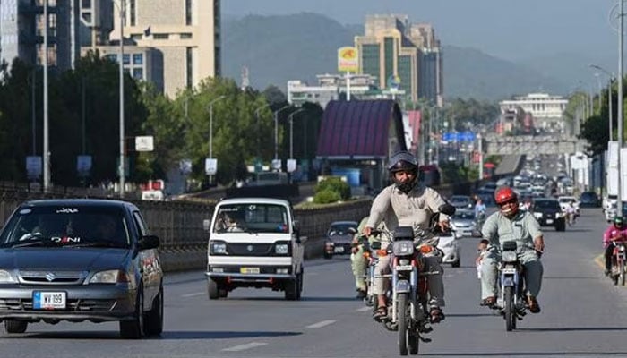 The picture shows people travelling. — AFP/File