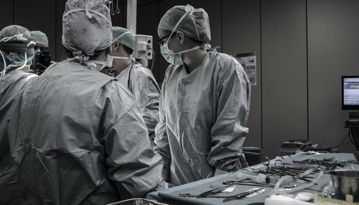 A representational image shows a team of doctors who are treating a patient in an operation theatre. — Unsplash/File