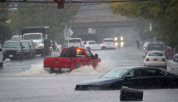 An abandoned vehicle sits in floodwaters during a heavy rain storm in the New York City suburb of Mamaroneck in Westchester County, New York, US, September 29, 2023. — Reuters