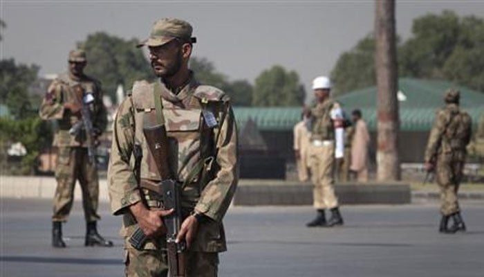 Armed soldiers stand guard outside Pakistans army headquarters in Rawalpindi in this undated image. — Reuters/File