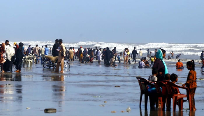 A large numbers of people are enjoying and cooling themselves during a hot weather of summer season, at sea view beach in Karachi on Sunday, September 24, 2023. — PPI