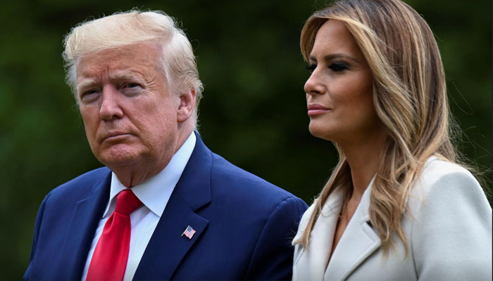 Former US president Donald Trump and first lady Melania Trump walk from the Marine One helicopter back to the White House after travelling to Fort McHenry in Baltimore for Memorial Day holiday commemorations from Washington, US, May 25, 2020.—Reuters