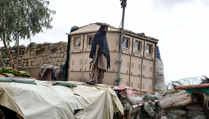 A Taliban security personnel stands guard at the Afghanistan-Pakistan border in Spin Boldak on December 12, 2022. — AFP