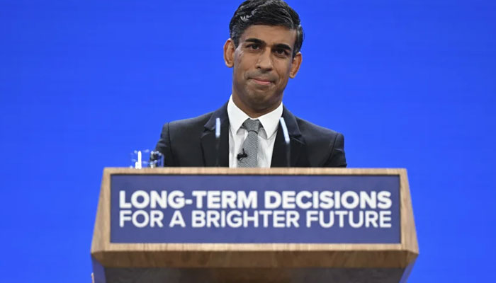 Britains Prime Minister Rishi Sunak addresses delegates at the annual Conservative Party Conference in Manchester, northern England, on October 4, 2023. AFP