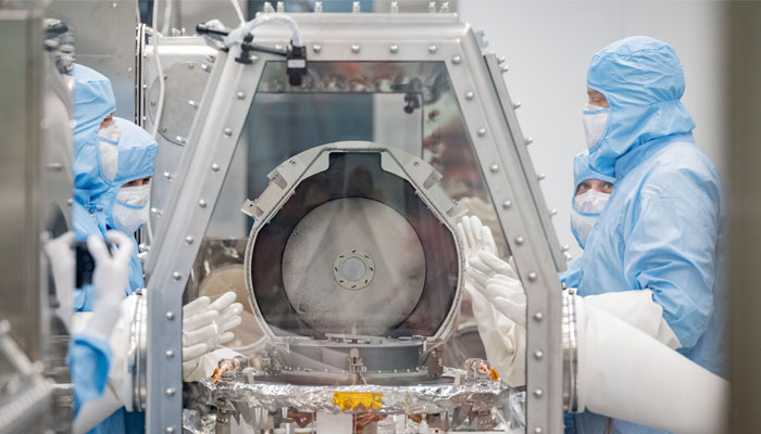 Scientists examine the OSIRIS-REx asteroid sample return canister. — X/@Astromaterials