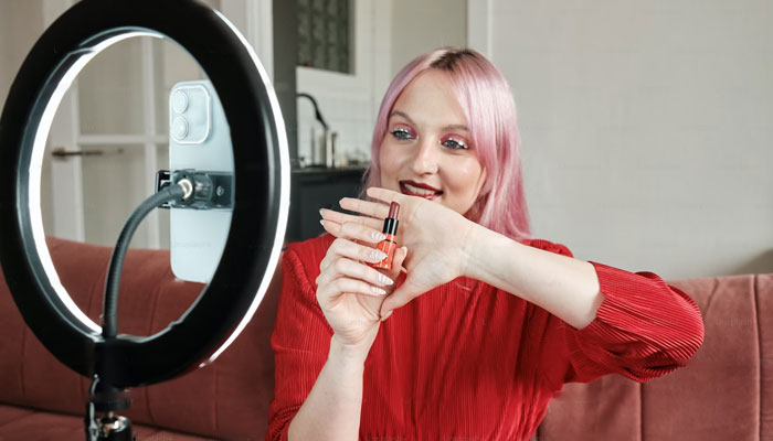 A representational picture showing an influencer in the middle of a makeup tutorial. — Unsplash/File