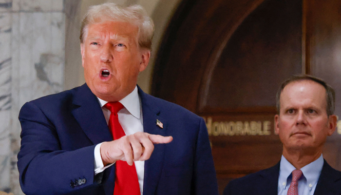 Former US President Donald Trump speaks to members of the media during the third day of his civil fraud trial in New York on October 4, 2023. — AFP