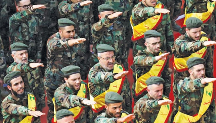 Members of Hezbollah salute during the funeral of three fighters killed in combat in Syria in the southern Lebanese city of Nabatieh. — AFP/File