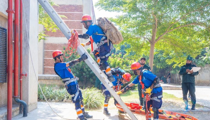 Rescue officials of Alkhidmat Foundation Pakistan demonstrate their skills during the competition. —  Alkhidmat Foundation