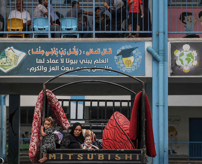 Palestinians fleeing Israeli air strikes take refuge in a school run by the United Nations in Gaza City on October 7, 2023. — AFP