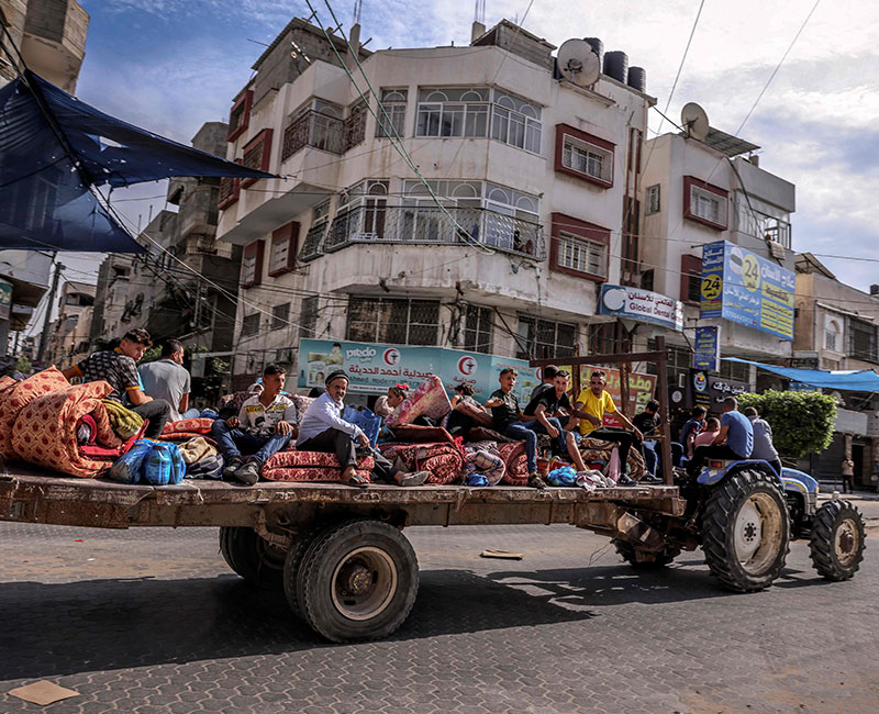 Palestinians flee Gaza City following Israeli air strikes on October 7, 2023. — AFP