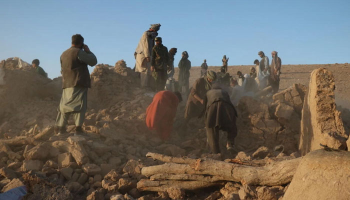 Residents clear debris from a damaged house after an earthquake in Sarbuland village in Herat province, Afghanistan, on October 7, 2023. — AFP