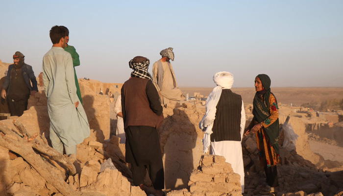 Afghan residents clear debris from a damaged house after earthquake in Sarbuland village of Zendeh Jan district of Herat province on October 7,2023. — AFP