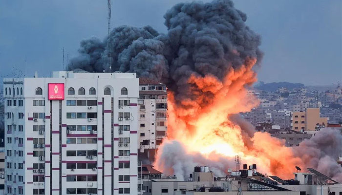 Smoke and flames billow after Israeli forces struck a high-rise tower in Gaza City, October 7, 2023. — Reuters