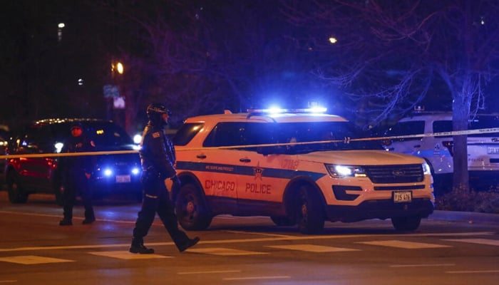 Chicago Police officers monitor the area outside of the Chicago Mercy Hospital after a shooting. — AFP/File