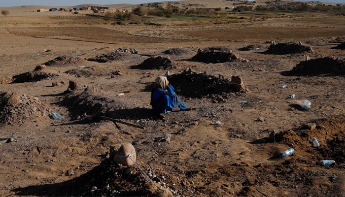 An Afghan girl cries over her mothers grave in a cemetery for victims of the recent earthquake in the district of Zinda Jan, in Herat, Afghanistan October 9, 2023. — Reuters