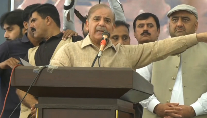 PML-N President Shehbaz Sharif addressing traders in Lahore, on October 12, 2023, in this still taken from a video. — YouTube/GeoNews