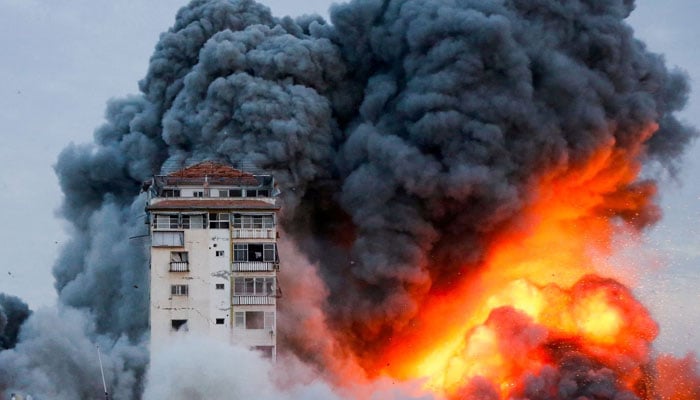 Smoke and flames billow after Israeli forces struck a high-rise tower in Gaza City, October 7. —Reuters