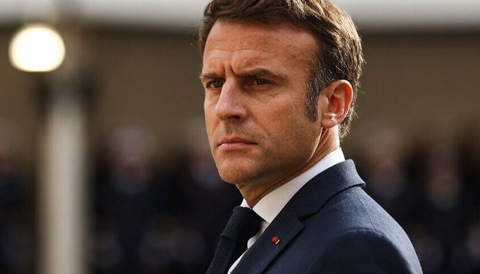 French President Emmanuel Macron looks on as he attends a tribute ceremony to veterans of the Algerian War, at the Hotel National des Invalides, in Paris on October 18, 2022. AFP/File