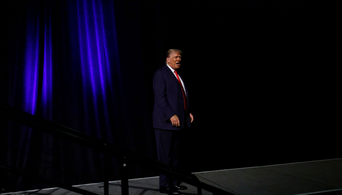 Former President Donald Trump leaves after delivering remarks at a rally hosted by Club 47 USA at the Palm Beach County Convention Center on October 11, 2023, in West Palm Beach, Florida. — AFP