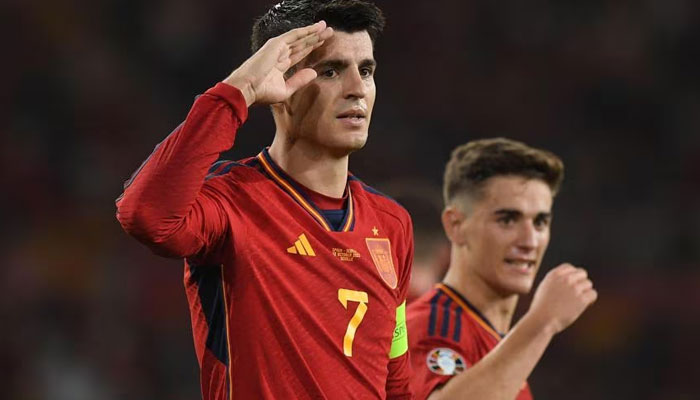 Álvaro Morata (left) celebrates scoring for Spain against Scotland. AFP