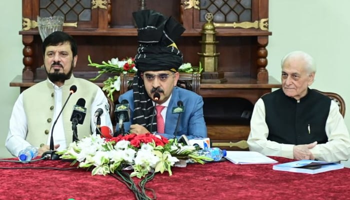 Caretaker Prime Minister Anwaar-ul-Haq (centre) addressing the press conference in Peshawar, on October 13, 2023. — APP