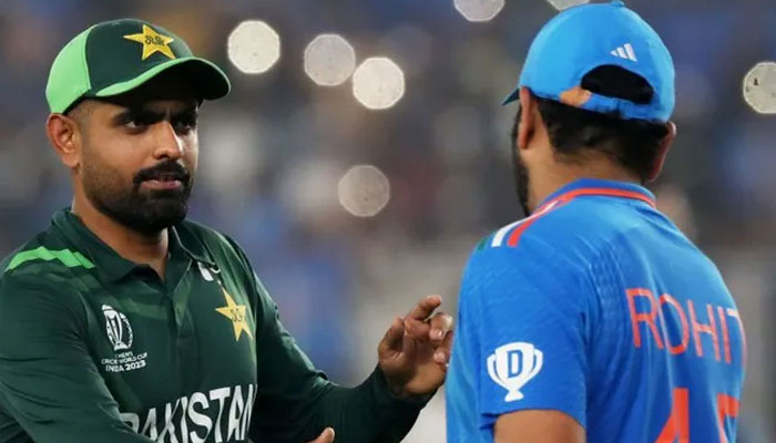 Pakistans skipper Babar Azam (left) shakes hands with Indian captain Rohit Sharma after losing the World Cup 2023 match on October 14, 2023. — ICC