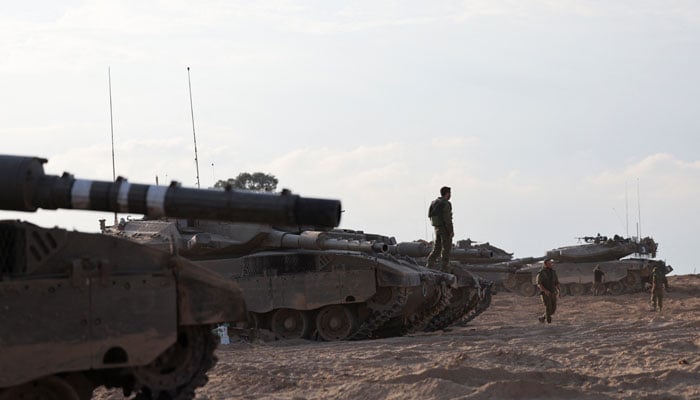 Israeli tanks are seen in the aftermath of a mass infiltration by Hamas gunmen from the Gaza Strip, in Kibbutz Beeri in southern Israel, October 14, 2023. — Reuters