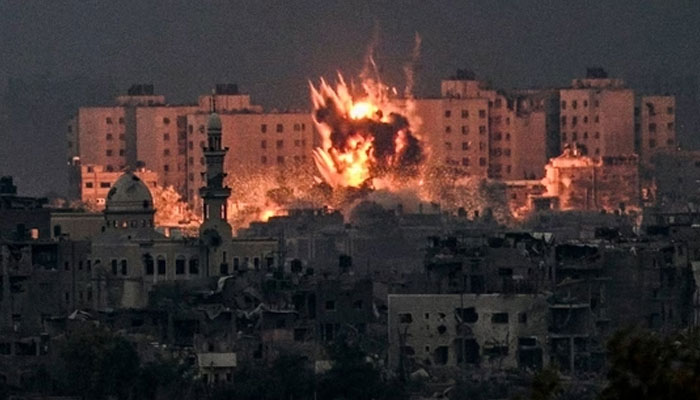 A fireball erupts during Israeli bombardment in the northern Gaza Strip on October 14, 2023. — AFP