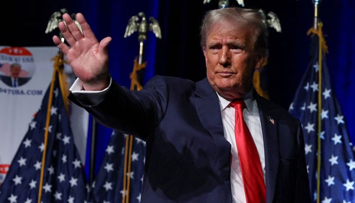 Former US President and Republican presidential candidate Donald Trump waves at the Club 47 USA event in West Palm Beach, Florida, US on October 11, 2023. — Reuters