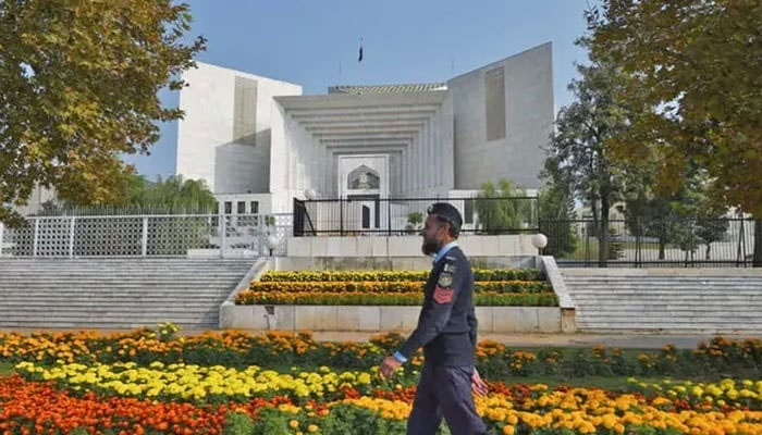 A policeman walks past the Supreme Court building in Islamabad in this undated photo — AFP/File