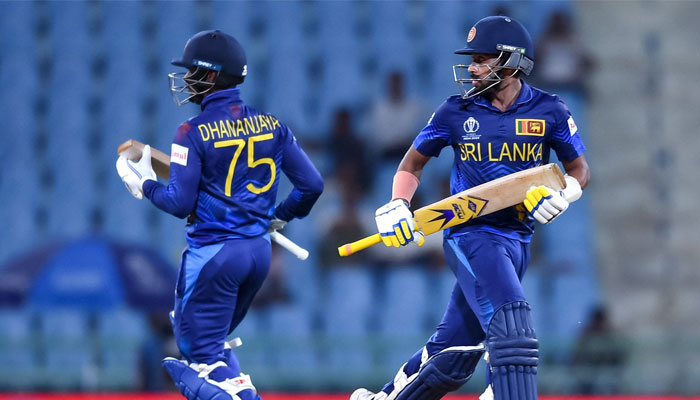 Sri Lanka´s Sadeera Samarawickrama (right) and Dhananjaya de Silva run between the wickets during the 2023 ICC Men´s Cricket World Cup between  the Netherlands and Sri Lanka at the Ekana Cricket Stadium in Lucknow on October 21, 2023. — AFP