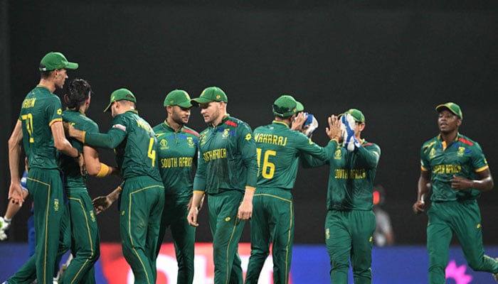 South Africa´s players celebrate after the dismissal of England´s captain Jos Buttler during the 2023 ICC Men´s Cricket World Cup between England and South Africa at the Wankhede Stadium in Mumbai on October 21, 2023. — AFP
