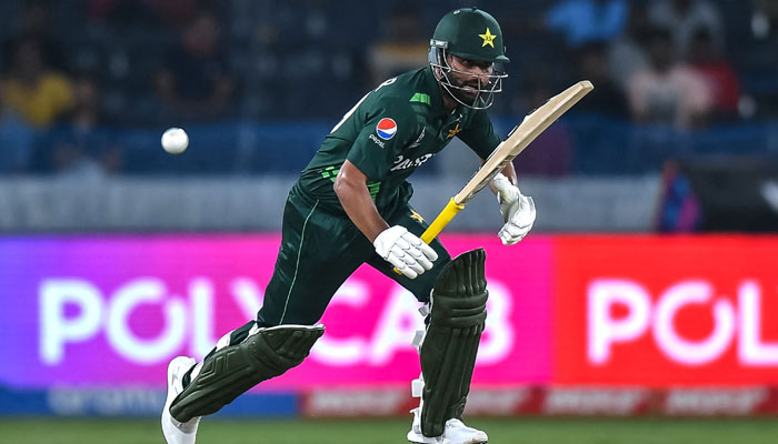 Pakistan´s Fakhar Zaman runs after playing a shot during a warm-up match between Pakistan and Australia ahead of the ICC mens cricket World Cup, at the Rajiv Gandhi International Cricket Stadium in Hyderabad on October 3, 2023. — AFP