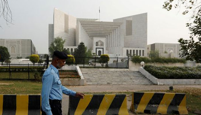 A policeman walks past the Supreme Court building in Islamabad, Pakistan October 31, 2018. — Reuters