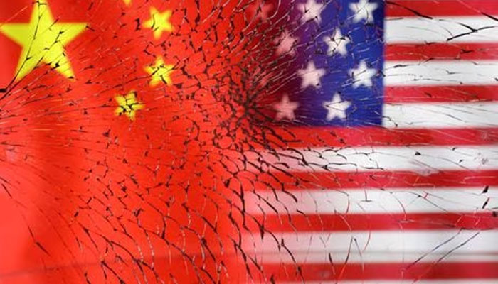 US and Chinese flags are seen through broken glass in this illustration taken, January 30, 2023. — Reuters