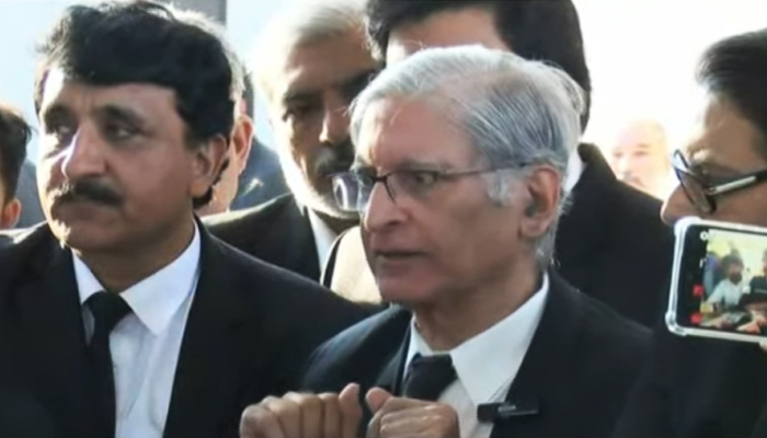 Aitzaz Ahsan, one of the petitioners in the military trial case, speaks to journalists outside the Supreme Court in Islamabad, on October 23, 2023, in this still taken from a video. — YouTube/GeoNews