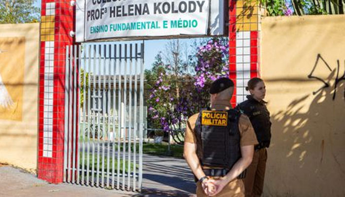 Military police officers stand in front of the Professora Helena Kolody public school where at least one student has died after a school shooting in Cambe, Parana state, Brazil, June 19, 2023.—Reuters