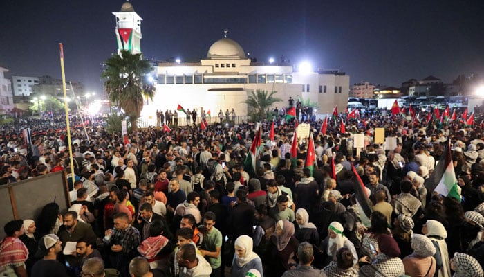 People hold Palestinian flags as Jordanians gather during a protest in support of Palestinians in Gaza, amid the ongoing conflict between Israel and Palestinian group Hamas, near the Israeli embassy, in Amman, Jordan on October 24, 2023. — Reuters