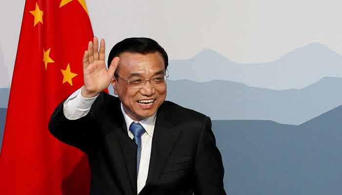 Chinese Premier Li Keqiang waves to media after a statement during the second day of an official visit to Switzerland at the governments guesthouse Lohn in the village of Kehrsatz, near the Swiss capital of Bern, May 24, 2013. —Reuters/File