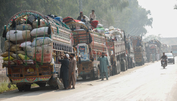 Trucks loaded with belongings are seen as Afghan refugees are returning home, after Pakistan gives the last warning to undocumented immigrants to leave, outside the United Nations High Commissioner for Refugees (UNHCR) repatriation centres in Azakhel town in Nowshera, Pakistan October 30, 2023. — Reuters