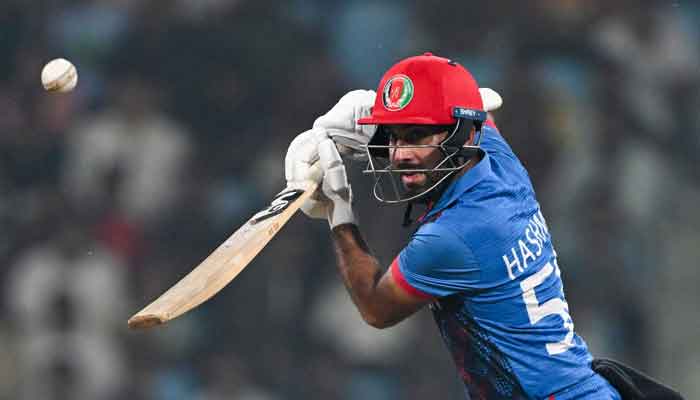 Afghanistans captain Hashmatullah Shahidi watches the ball after playing a shot during the 2023 ICC Men´s Cricket World Cup one-day international (ODI) match between Netherlands and Afghanistan at the Ekana Cricket Stadium in Lucknow on November 3, 2023. —AFP