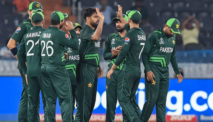 Pakistans Haris Rauf celebrates with teammates after taking the wicket of Netherlands captain Scott Edwards during the World Cup 2023 match at Hyderabads Rajiv Gandhi International Stadium on October 6, 2023. — AFP