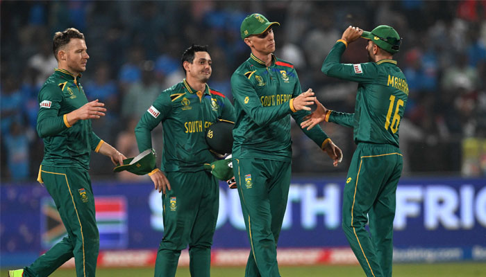 South Africa´s players celebrate their victory at the end of the World Cup match between New Zealand and South Africa at the Maharashtra Cricket Association Stadium in Pune on November 1, 2023. — AFP